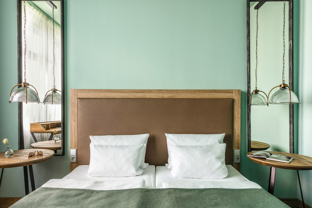 Holophane Pendants Transform the Bedroom of This Berlin Hotel