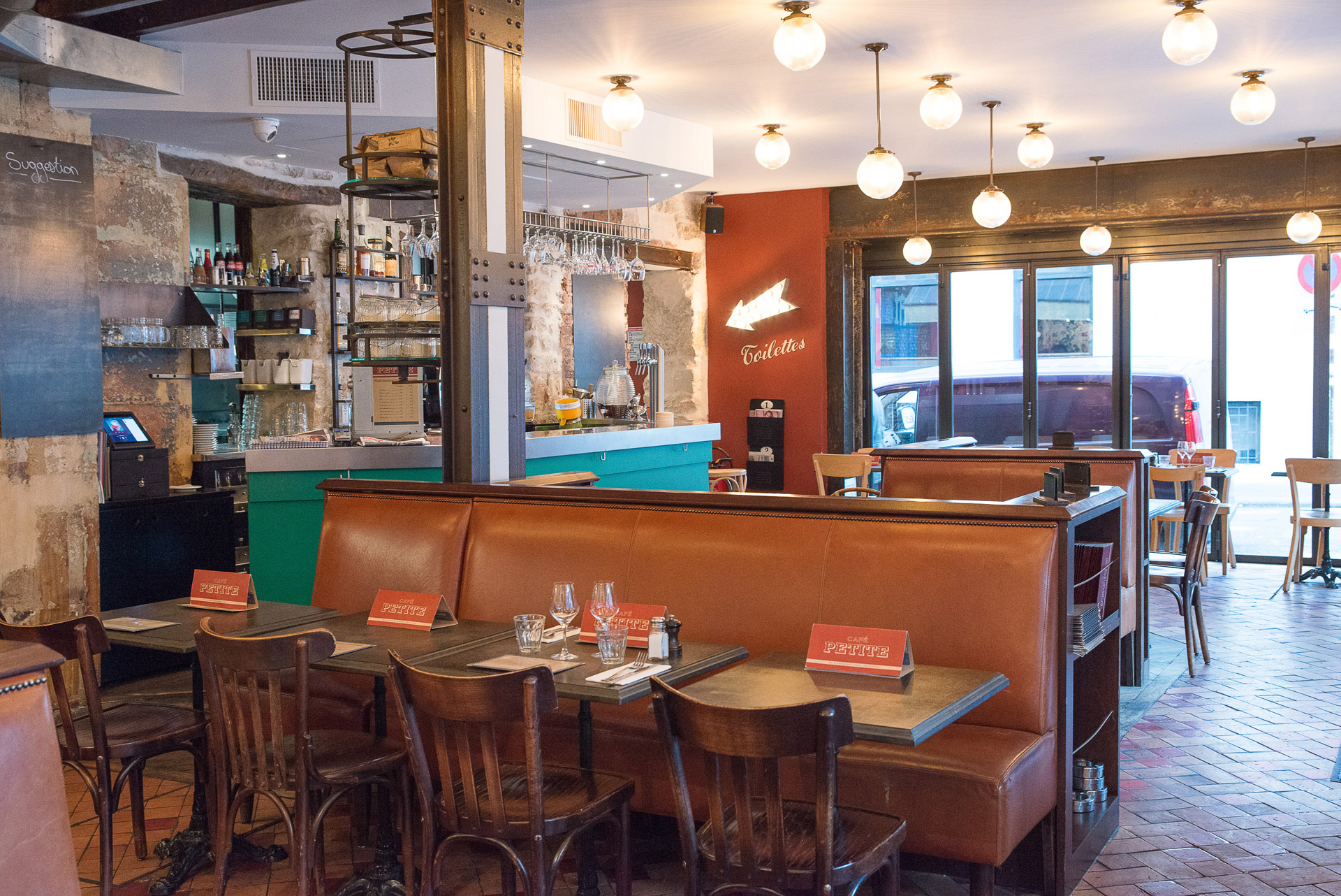Enjoy the ultimate Parisian café experience under our ceiling lights at Café Petite