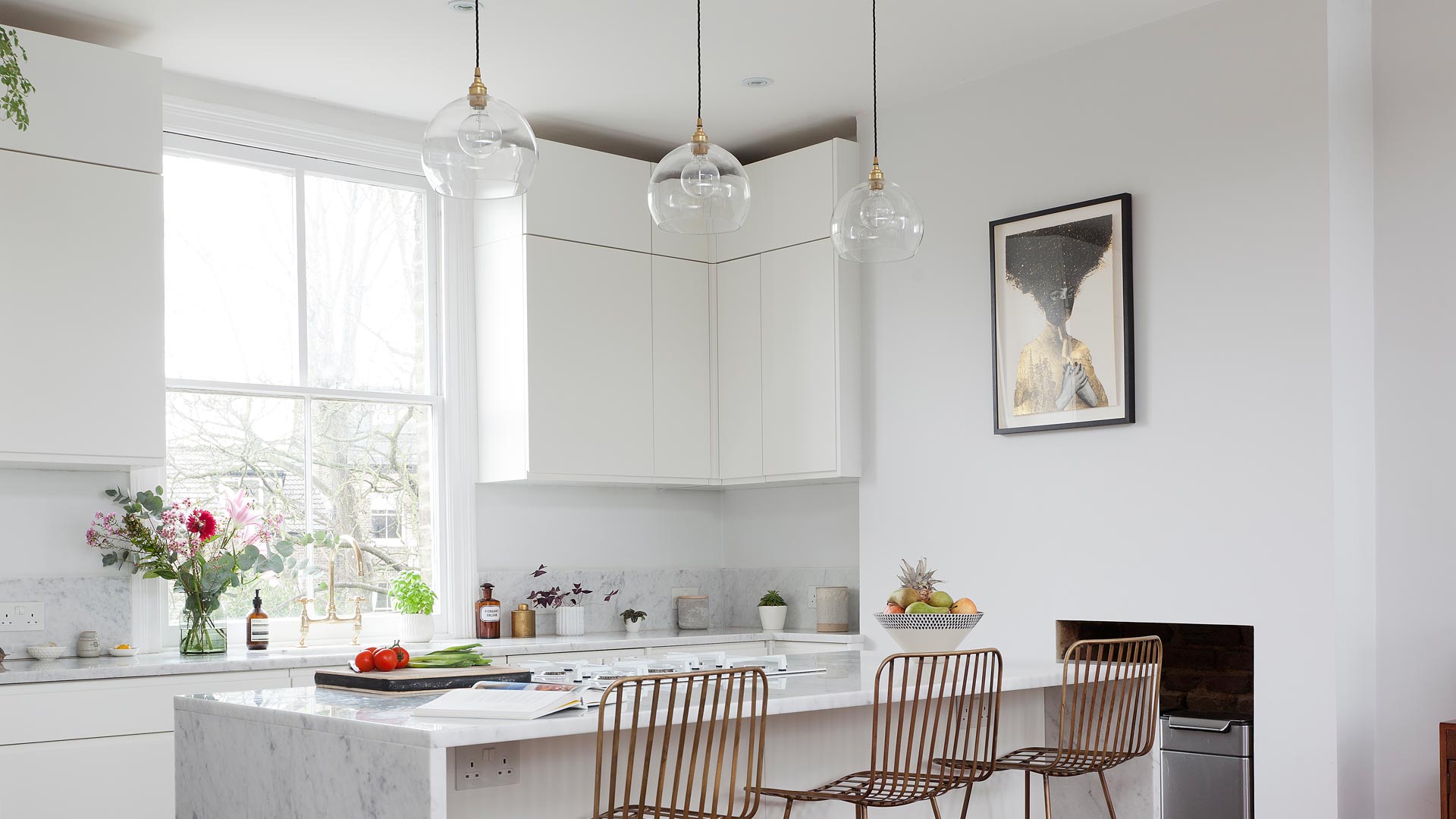 Our Eden globe pendants look perfect above this kitchen island